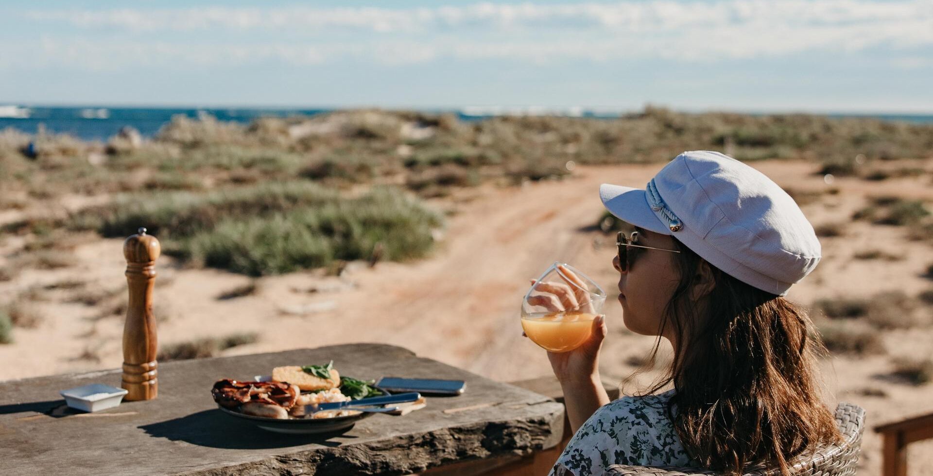 women enjoying a drink overlooking ningaloo reef