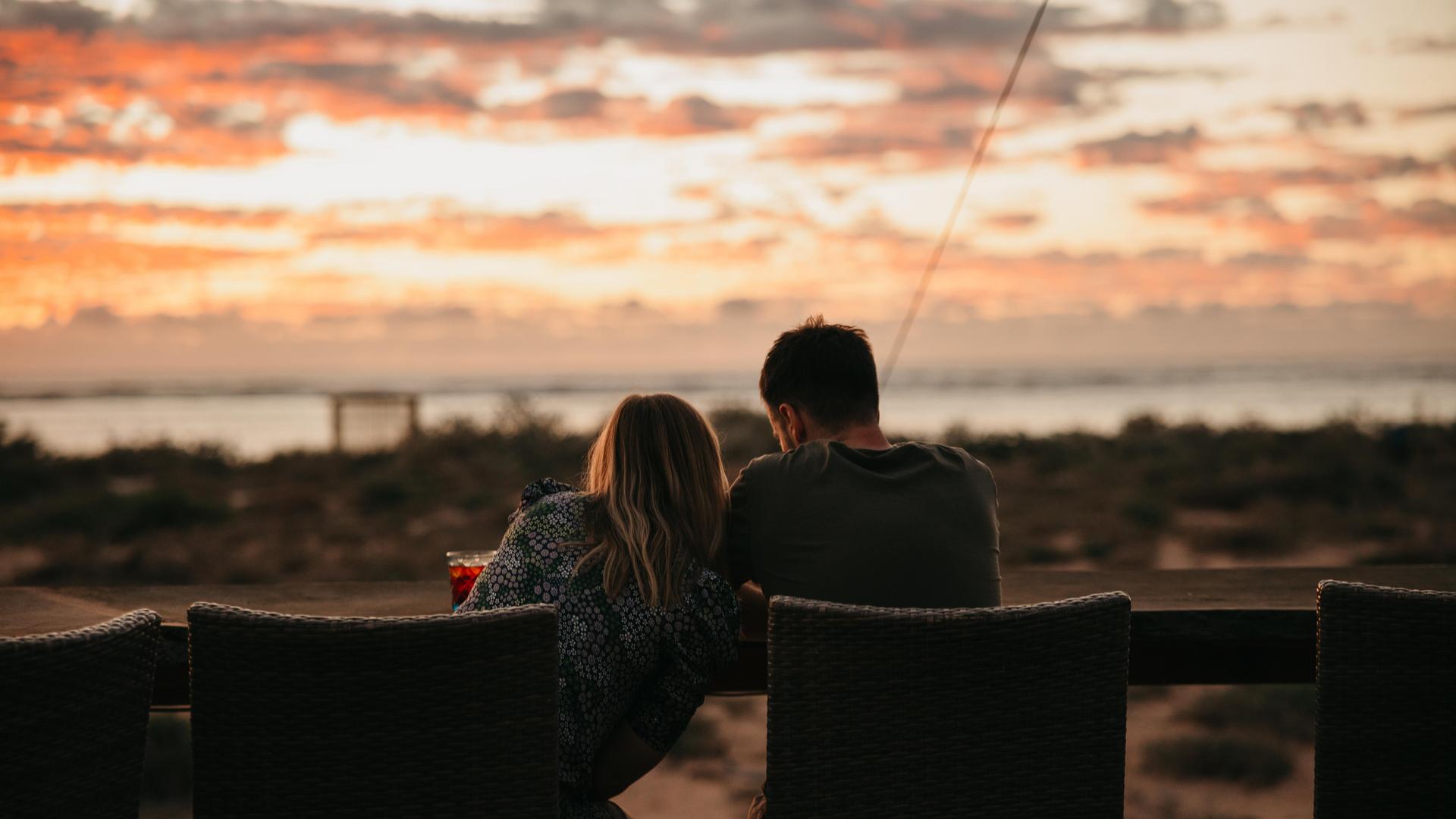two people watching sunset