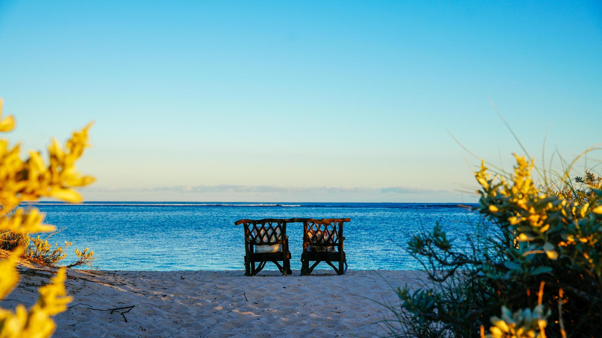 chairs looking out of beach sunrise