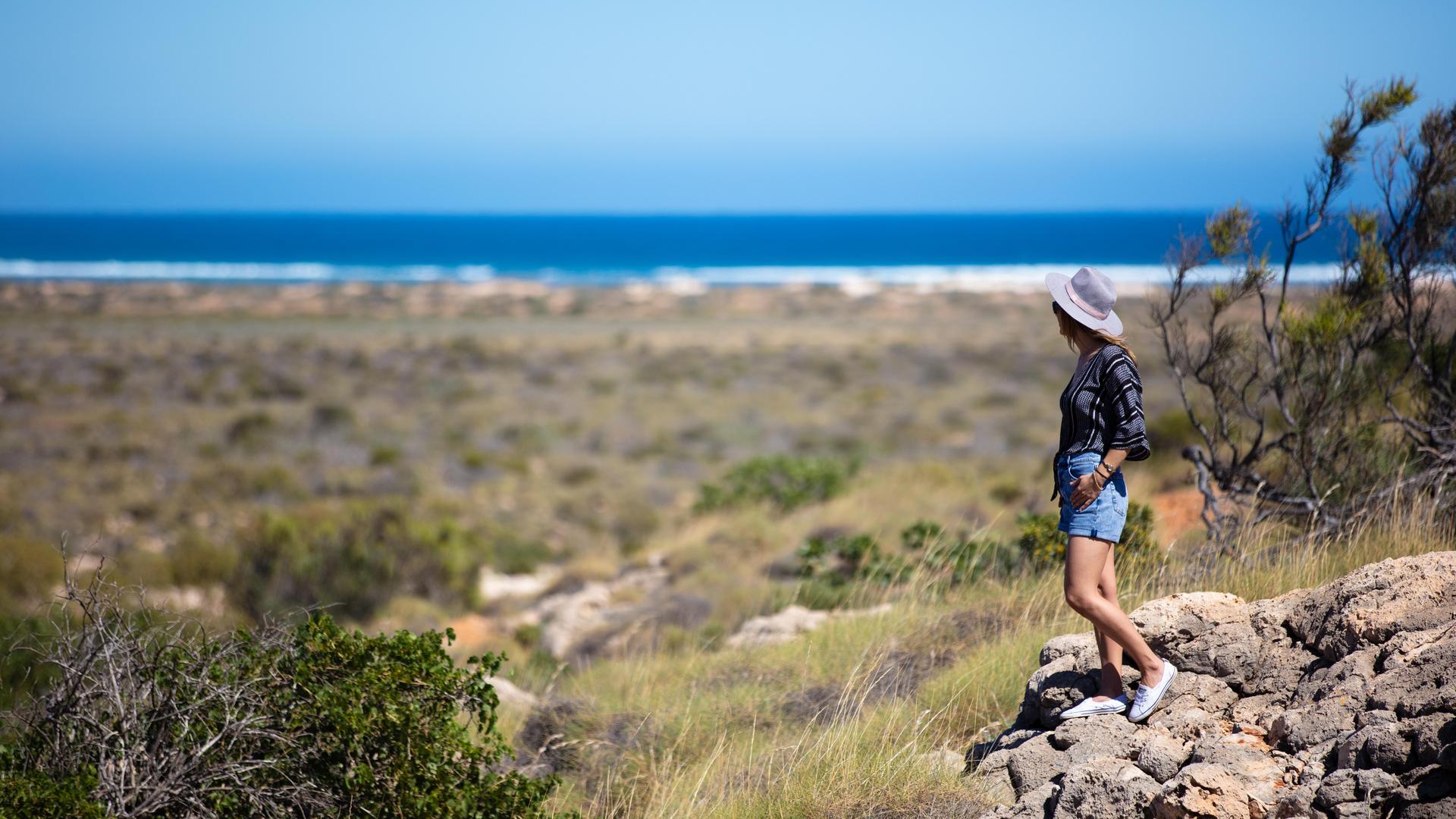woman standing on rock at national park
